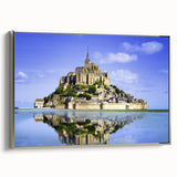 Landscape art painting of a scenic French village, displayed on a silver-framed canvas, featuring vibrant.