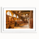 Textured art depicting an abstract scenery of Normandy, France, in muted earth tones on a framed white mat.