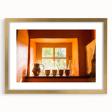 Abstract art print of a South France scenery in muted earth tones on a framed canvas, suitable for dining room decor.