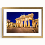 Abstract art print of Berlin cityscape in muted gray and blue tones on a framed canvas.