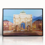 Large abstract wall art depicting a stylized Munich cityscape in muted earth tones on a framed acrylic panel.