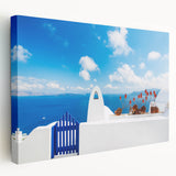 Large art print of Santorini landscape on stretched canvas, showcasing the white buildings and blue domes under a clear sky.