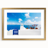 Extra large wall art featuring an abstract depiction of Santorini, Greece in blue and white tones, framed in gold.