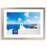 Textured art print of Santorini with abstract blue and white tones on a silver-framed canvas, suitable for bedroom decor.