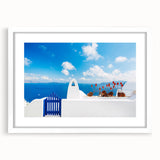 Abstract art print of Santorini with blue and white tones on a framed canvas, suitable for bedroom or dining room decor.