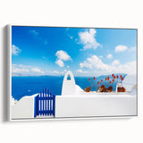 Vintage poster art of Santorini with vibrant blue and white tones on a framed canvas, suited for living room decor.