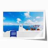 Rolled print of Santorini scenery with white buildings and blue domes, ideal for art wall dining room.