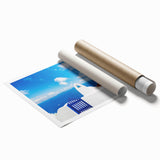 White-washed buildings of Santorini with blue domes, in muted tones, on a rolled print.