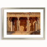 Extra large wall art featuring an abstract depiction of a Greek scenery in muted earth tones, framed in silver.