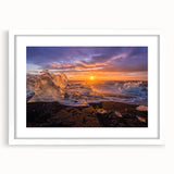 Textured art depicting an abstract Greenland scenery in muted green and blue tones on a framed white mat.