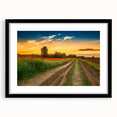 Abstract art print featuring textured, colorful depiction of a European scenery on a large black framed canvas.