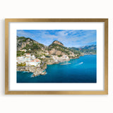 Abstract art print of the Amalfi Coast in pastel shades, framed in gold, ideal for bedroom or dining room decor.