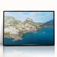 Large abstract wall art depicting the Amalfi Coast in muted blue and white tones, framed in black acrylic.