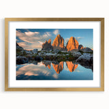 Abstract art print of the Dolomites in Italy, featuring muted earth tones on a framed canvas, suitable for dining room decor.
