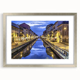 Extra large abstract art print of Milan scenery in muted earth tones on a textured canvas, framed in silver.