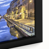 Black wall art featuring a textured depiction of Milan's skyline on a large framed canvas with colorful accents.