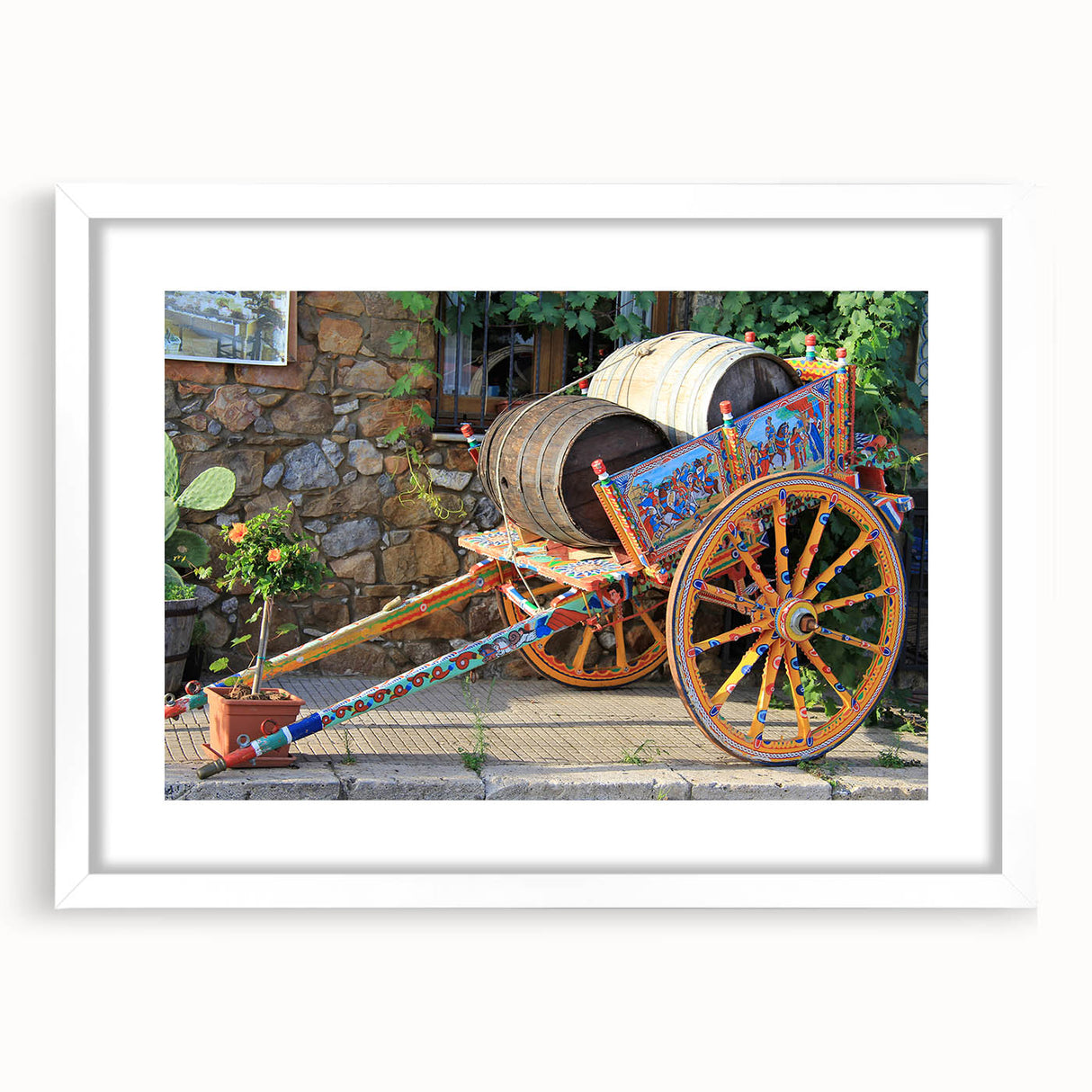 Textured abstract art print of Sicilian landscape in muted earth tones on a framed white mat, suitable for bedroom decor.