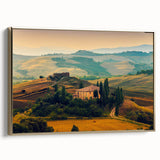 Framed canvas featuring a vintage-style landscape painting of the Tuscany region, with muted earth tones.