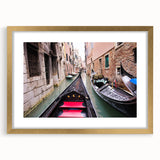 Abstract art print of Venice scenery in muted gold and blue tones on a framed canvas, suitable for dining room decor.