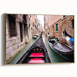 Framed canvas featuring a vintage-style landscape painting of Venice in muted gold and black tones.