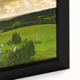 Close-up of a textured black wall art featuring a colorful European scenery on a framed canvas, ideal for living room decor.