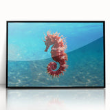 Large abstract wall art of the Mediterranean Sea in muted blue and white tones, framed in black acrylic.