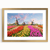 Abstract art print of a European scenery in muted earth tones, framed in gold, suitable for bedroom or dining room decor.