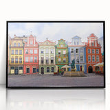 Large abstract wall art depicting a European scenic view in muted earth tones, framed in black acrylic.