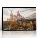 Large abstract wall art depicting a European Romanian scenery in muted earth tones, framed in black acrylic.