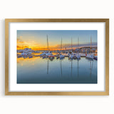 Abstract art print of Sochi landscape in muted gold and blue tones, framed with a gold mat, ideal for dining room decor.