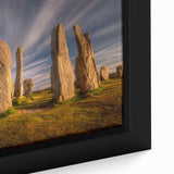 Close-up of a black wall art featuring a textured European Scottish landscape on a framed canvas.