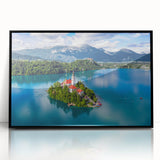 Large abstract wall art depicting a stylized European scenery in muted earth tones, framed in black acrylic.