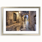 Extra large abstract art print depicting a textured Barcelona scenery in muted earth tones, framed with a silver mat.