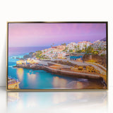 Art deco poster of a scenic European landscape in soft pastel colors, framed in gold acrylic.