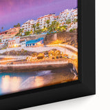 Black wall art featuring a textured depiction of a European scenery in vibrant colors on a framed canvas.