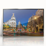 Mid-century modernist art depicting Madrid skyline in muted earth tones on a silver-framed acrylic print.