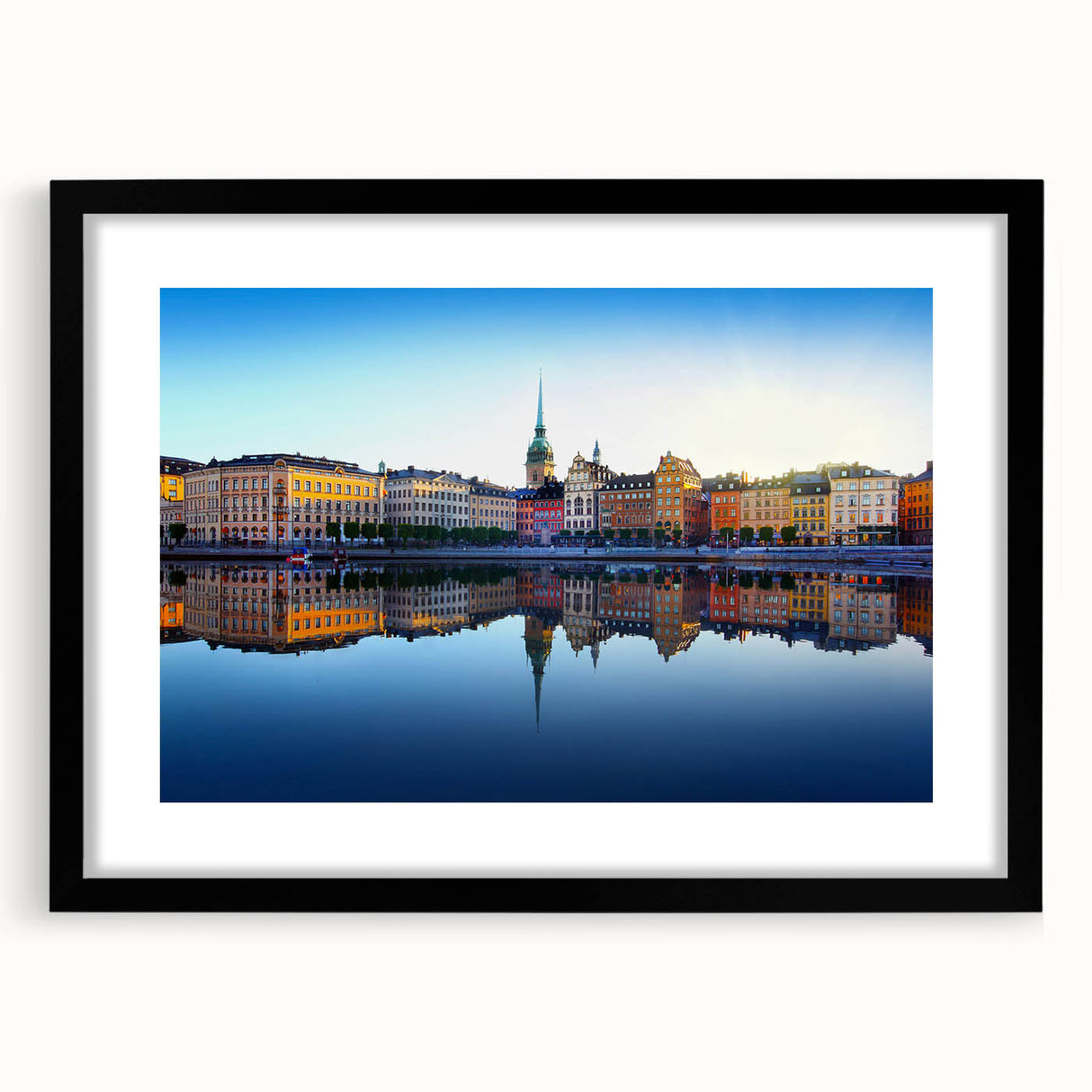 Abstract art print of a colorful Stockholm cityscape in vibrant shades on a framed black mat.