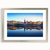 Textured abstract art print of Stockholm scenery in muted blue and gray, framed in silver, ideal for bedroom wall decor.