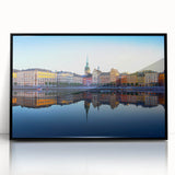 Large abstract wall art depicting Stockholm's skyline in muted blues and grays on a framed acrylic print.