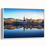 Vintage poster art of Stockholm, featuring colorful buildings on a black background, printed on an extra-large framed canvas.