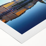 Art deco poster of Stockholm scenery in muted blue and yellow tones on rolled canvas, suitable for dining room decor.