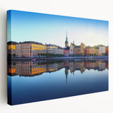 Large art depicting Stockholm scenery in muted blue and yellow tones on stretched canvas, suitable for kitchen wall art.