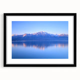 Extra large abstract art print of Geneva scenery in vibrant colors on a textured canvas, framed in black.