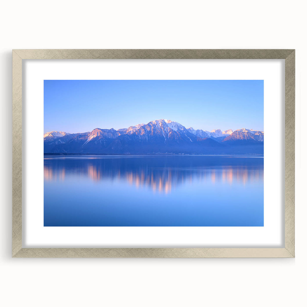 Textured art print of Geneva scenery in muted blue tones on a silver-framed mat, ideal for bedroom decor.