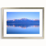 Textured art print of Geneva scenery in muted blue tones on a silver-framed mat, ideal for bedroom decor.
