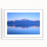 Abstract art print of Geneva cityscape in muted blue and gray tones on a white framed canvas, suitable for dining room decor.