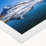 Art deco poster featuring a serene Swiss landscape in muted green and blue tones on rolled canvas.