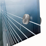 Large abstract wall art depicting a European scenery in muted gray and blue tones on acrylic glass.