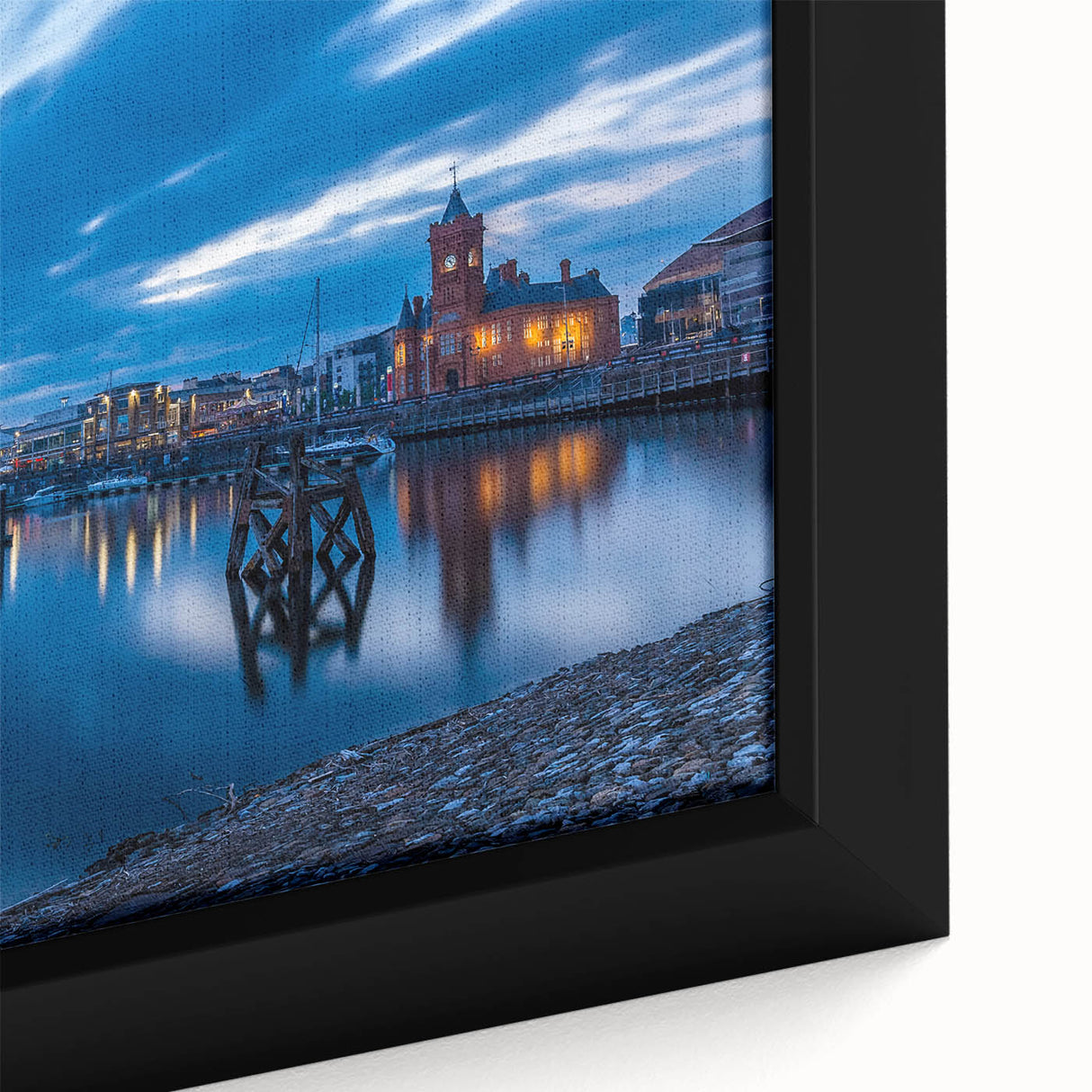 Close-up of extra large black wall art featuring a textured, colorful European Welsh scenery on framed canvas.
