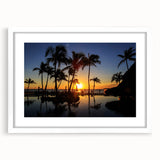 Abstract art print of Cabo San Lucas with vibrant blue and white tones, framed in white, suitable for dining room decor.